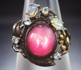 Серебряное кольцо с рубином, кристаллическими эфиопскими опалами и голубыми топазами