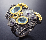 Серебряное кольцо с голубыми топазами и аметистами