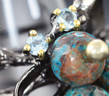 Серебряное кольцо с говлитом и голубыми топазами