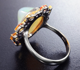 Серебряное кольцо с кристаллическим эфиопским опалом 6,85 карата и сапфирами