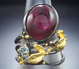 Серебряное кольцо с рубином и голубыми топазами