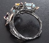 Серебряное кольцо с голубыми топазами, аметистами и желтыми сапфирами