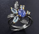 Серебряное кольцо с танзанитом и голубыми топазами