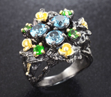 Серебряное кольцо с голубыми топазами и дипосидами