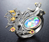 Серебряное кольцо с кристаллическим эфиопским опалом и красными сапфирами