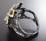 Серебряное кольцо с голубыми топазами и зелеными турмалинами Серебро 925