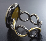 Серебряное кольцо с кабошоном золотистого сфена  Серебро 925