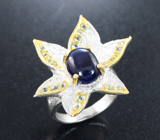 Серебряное кольцо с насыщенно-синим сапфиром и голубыми топазами