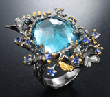 Серебряное кольцо с голубым топазом 26,33 карата и васильковыми сапфирами