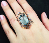 Серебряное кольцо с голубым топазом 26,33 карата и васильковыми сапфирами