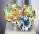 Великолепное серебряное кольцо с голубым топазом и эфиопскими опалами