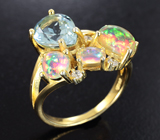 Великолепное серебряное кольцо с голубым топазом и эфиопскими опалами