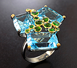 Серебряное кольцо с голубыми топазами 23,12 карата и диопсидами