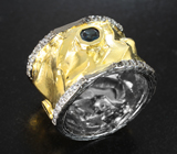 Необычное серебряное кольцо с насыщенно-синим топазом