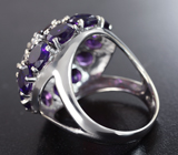 Крупное серебряное кольцо с родолитами и аметистами