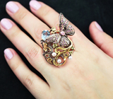 Серебряное кольцо с голубым топазом, жемчугом, перидотами, розовыми турмалинами и аметистами