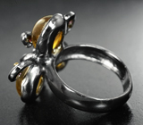 Серебряное кольцо с кварцем с эффектом кошачьего глаза, аметистами и родолитами