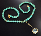 Серебряное колье с голубыми топазами и сферами говлита Серебро 925