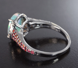 Серебряное кольцо с ограненным эфиопским опалом 2,22 карата и красными сапфирами
