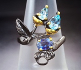 Серебряное кольцо с кианитом и голубыми топазами