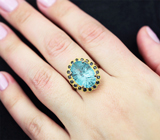 Серебряное кольцо с голубым топазом лазерной огранки 8,32 карата и синими сапфирами