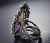 Серебряное кольцо с резным аметрином и голубыми топазами