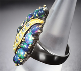 Серебряное кольцо с кристаллическими черными опалами и голубыми топазами