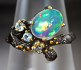 Серебряное кольцо с кристаллическим эфиопским опалом, голубыми топазами и танзанитом