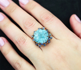 Серебряное кольцо с голубым топазом лазерной огранки 12,12 карата и синими сапфирами