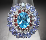 Яркое серебряное кольцо с голубым топазом, танзанитами и родолитами