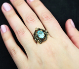 Серебряное кольцо с голубым топазом и альмандинами гранатами