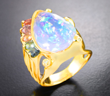 Золотое кольцо с ограненным эфиопским опалом со сквозной многоцветной опалесценцией 6,04 карата, разноцветными сапфирами и бриллиантами