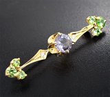 Золотая брошь с нежно-сиреневой шпинелью 1,91 карата, уральскими демантоидами 1,4 карата и бриллиантами