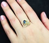 Серебряное кольцо с кристаллическим черным опалом и голубыми топазами