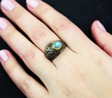Серебряное кольцо с кристаллическим эфиопским опалом и голубым топазом