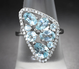 Оригинальное серебряное кольцо с голубыми топазами