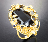 Стильное золотое кольцо с крупным ограненным шерлом 16,24 карата и синими сапфирами