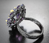 Серебряное кольцо с аметистом лазерной огранки 8,67 карата, малыми аметистами и танзанитами