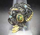 Серебряное кольцо с кристаллическим эфиопским опалом и голубыми топазами Серебро 925