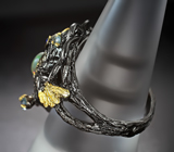 Серебряное кольцо с кристаллическим эфиопским опалом и голубыми топазами Серебро 925