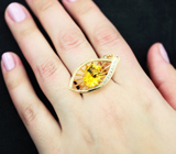 Золотое кольцо с ярким гелиодором авторской огранки 4,61 карата, синим сапфиром и бриллиантами высоких характеристик