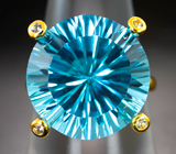 Золотое кольцо с голубым топазом лазерной огранки 16,9 карата и лейкосапфирами