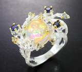 Серебряное кольцо с кристаллическим эфиопским опалом, синими сапфирами и голубыми топазами Серебро 925