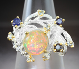 Серебряное кольцо с кристаллическим эфиопским опалом, синими сапфирами и голубыми топазами Серебро 925