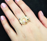 Серебряное кольцо с кристаллическим эфиопским опалом, синими сапфирами и голубыми топазами Серебро 925