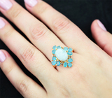 Серебряное кольцо с небесно-голубым ларимаром и «неоновыми» апатитами
