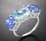 Серебряное кольцо с голубым топазом и танзанитами