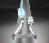 Кольцо с чистейшим платиновым муассанитом топовой огранки 0,86 карата и параиба турмалином 1,13 карата