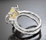 Серебряное кольцо с ограненным эфиопским опалом и родолитами