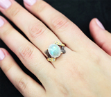 Серебряное кольцо с лунным камнем 3,45 карата и голубыми топазами